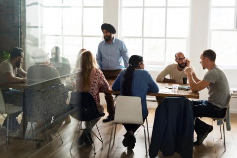 Interracial group of people in a workshop discussing cultural diversity